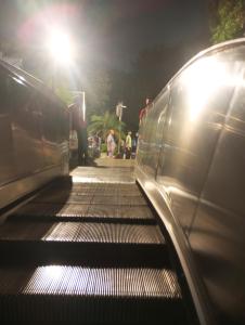 an empty escalator with people on it at night at Kaveri in Greater Noida