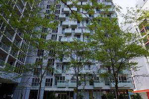 a tall building with trees in front of it at Downtown Toronto Condo with CN Tower View in Toronto