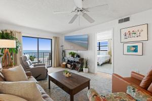 a living room with a view of the ocean at 512 - Oceanfront top floor corner 2 bedroom in New Smyrna Beach