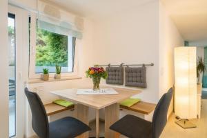 a small dining room with a table and chairs at Im Guggenbühl in Überlingen