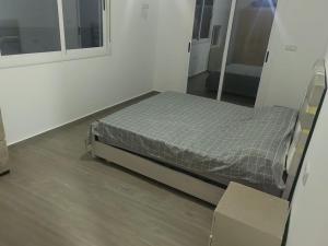 a bedroom with a bed in a room at ras el ma in Ras El Ma