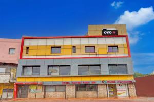 a building with an oops sign on top of it at SPOT ON Hotel Center Point Inn in Bhilai +22 photos