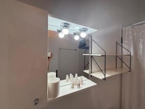 a bathroom with a mirror and a sink at Deda Apartments in Livadia +114 photos