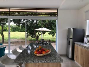 a bowl of fruit on a counter in a kitchen at Finca Villa Hayde in Flandes +7 photos