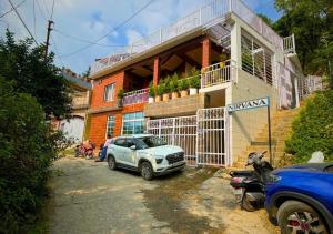 a car parked in front of a building at TownHill Homestay in Bhīm Tāl