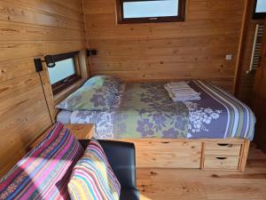 a small bedroom with two beds in a cabin at Mar&Mar Houseboat Studio in Amsterdam