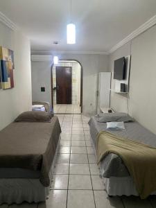 Katil atau katil-katil dalam bilik di Casa em Petrolina