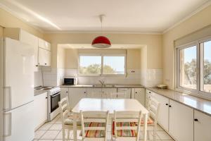 Η κουζίνα ή μικρή κουζίνα στο Residence by the Sea of Komi +9 φωτογραφίες