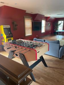 a living room with a large pool table at Greenwood Mansion-country Living in Greenwood +38 photos