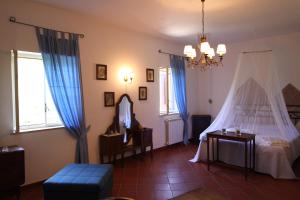 a bedroom with a bed with a mosquito net at La Masseria in Roccamonfina