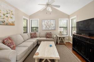 a living room with a couch and a table at Harbour Oaks #508 in Saint Simons Island
