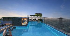 a swimming pool on top of a building at Airport Aura 5 Min Walk to Airport in Pune