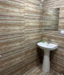 a bathroom with a sink and a mirror at Apart erevan 12 