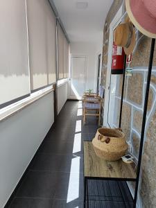 a room with a table with a basket on it at Casa dos Valentes in Bicas +1 photo
