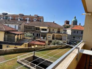 a view of a city from a balcony at Mary Apartment in Vercelli