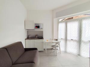 a living room with a couch and a table at Residence Mario Bianco in Milan