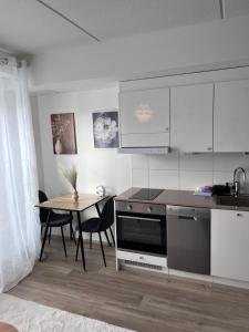 Kuchyň nebo kuchyňský kout v ubytování Lamminpää