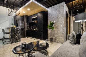 a living room with a couch and a table at Downtown Designer Apartments by ULIV in Tijuana