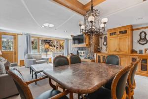 a dining room with a table and chairs at Lodge Tower 387 Three Bedroom Residence in Vail