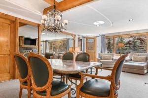 a dining room with a table and chairs at Lodge Tower 387 Three Bedroom Residence in Vail