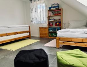 Postel nebo postele na pokoji v ubytování CHALET HOUBOVÝ VRCH