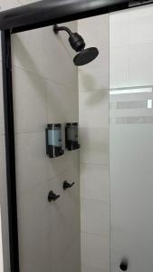 a shower with a glass door in a bathroom at Céntrico departamento con vista espectacular in Monterrey +20 photos