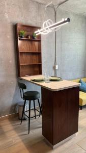 a kitchen with a desk with a chair and a light at Céntrico departamento con vista espectacular in Monterrey +30 photos