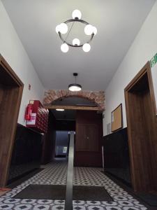 a hallway with a hallway leading into a building at Apartament przy Poczcie in Koszalin