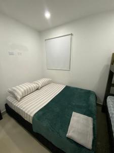 Postel nebo postele na pokoji v ubytování Apartamento para Grupos En La Boquilla BBB