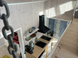 an overhead view of a small kitchen with a sink at Oceanview Mini-House - Stunning Views in Moskenes