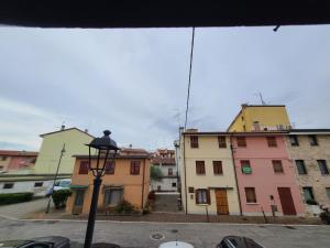 a view from a window of a street with buildings at Ca'del Porto in Marano Lagunare