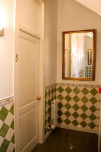 a bathroom with a door open and a white toilet at Monte da Lua in Sintra