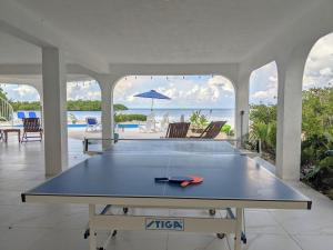 a ping pong table in the middle of a house at Ocean Dream in Marathon