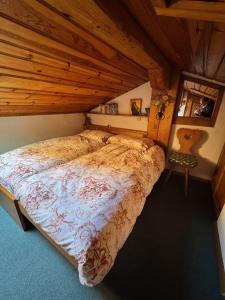 En eller flere senge i et værelse på Attico Cortina D'Ampezzo