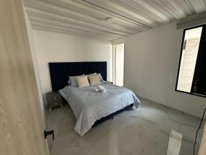 Giường trong phòng chung tại Apartamento Campestre con vistas de ensueño