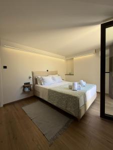 Ένα ή περισσότερα κρεβάτια σε δωμάτιο στο Petrochori Beach House