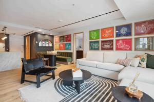 a living room with a white couch and a table at Lodge Tower 486 Two Bedroom Residence in Vail