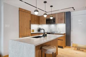 a kitchen with a sink and a counter top at Lodge Tower 486 Two Bedroom Residence in Vail