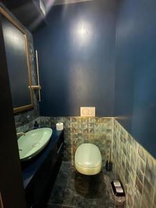 a bathroom with a toilet and a sink at KAI Condo 3 Min Walking to Beach in Donja Lastva +6 photos
