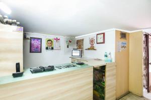 a kitchen with a stove and a counter top at SPOT ON Standard in Jabalpur +21 photos