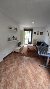 a living room with a couch and a table at Apartamentos Rurales Corias in Corias