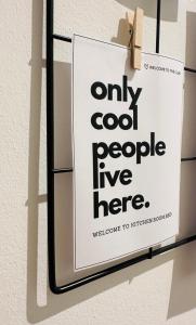 a sign that says only cool people live here on a wall at kitchenroombed - Top City-Lage I nahe Hbf I bis 5P I Aufzug I Tiefgarage I Terrasse in Halle an der Saale