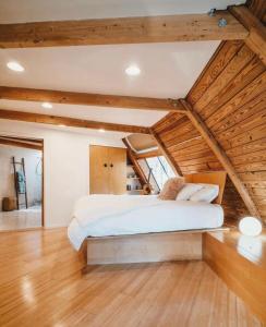 a bedroom with a large bed in a attic at Unique Dome Home With Hot Tub & Piano, on 28 acres in New Paltz