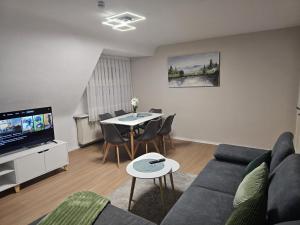 a living room with a couch and a table at Sea Berg in Friedrichshafen