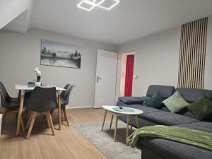 a living room with a couch and a table at Sea Berg in Friedrichshafen