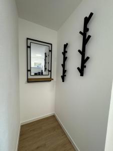 a mirror on a wall in a room at Ferienwohnung Wasser - Bude in Momlingen
