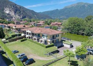an aerial view of a house with a parking lot at Camping Residence & Lodge Orchidea in Baveno
