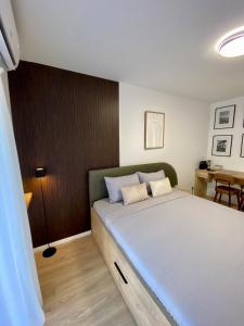 a bedroom with a large bed in a room at Studio8 centerapartment Prizren in Prizren
