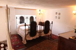 A bed or beds in a room at La Masseria