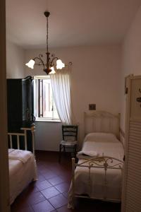 A bed or beds in a room at La Masseria